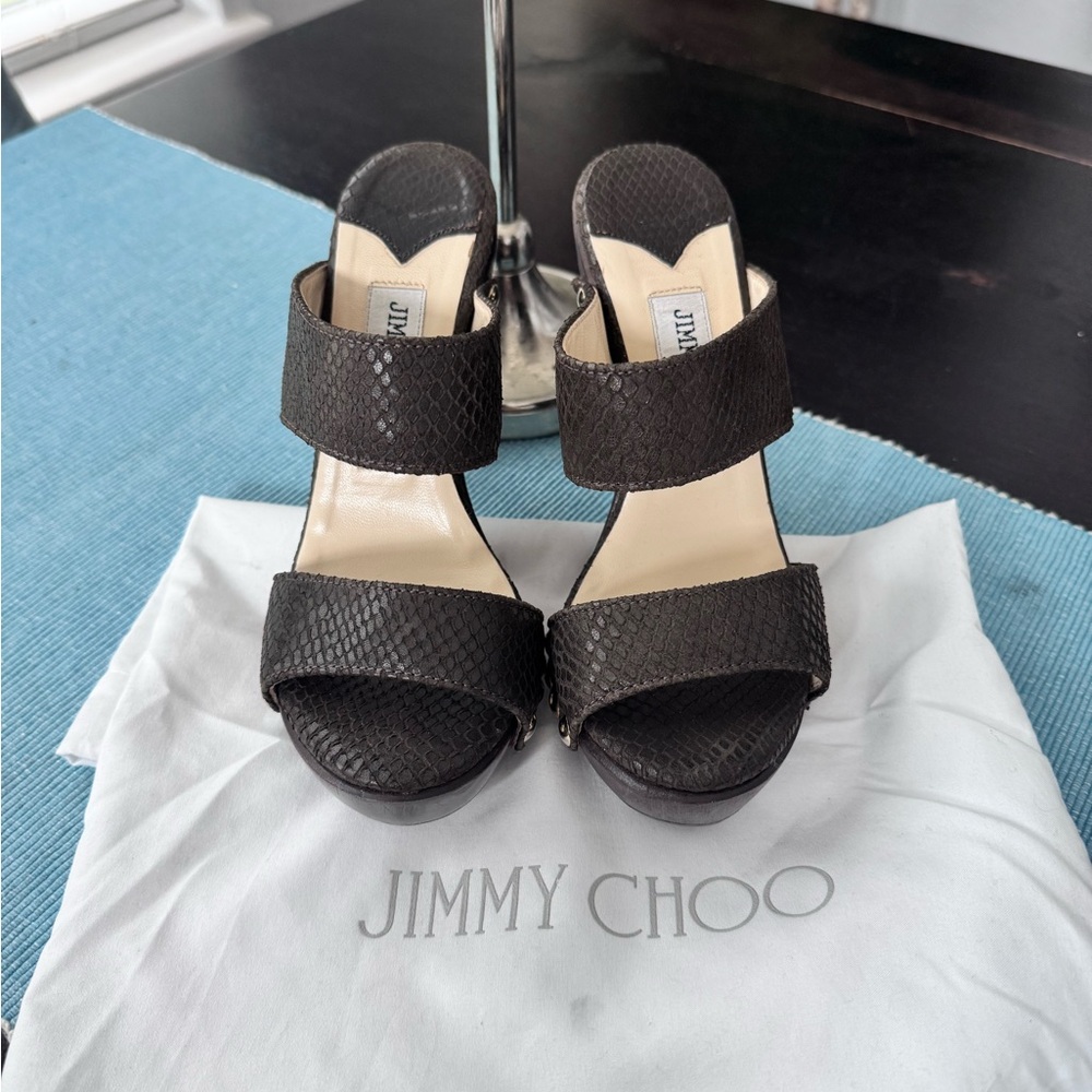 Jimmy Choo London snake embossed leather wooden platform mules.